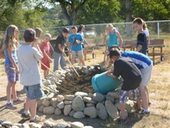 kids building rock pile