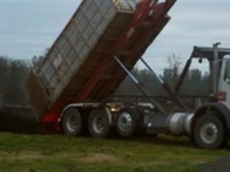 dump truck dumping dirt